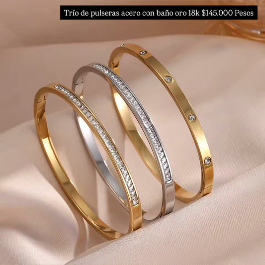 Trío de brazaletes acero con baño oro 18k