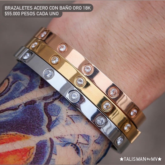 Brazalete grueso acero con baño oro 18k