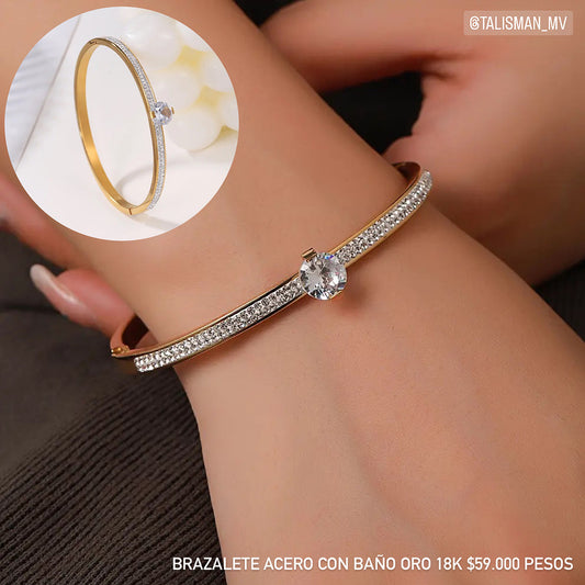 Brazalete acero con baño oro 18k