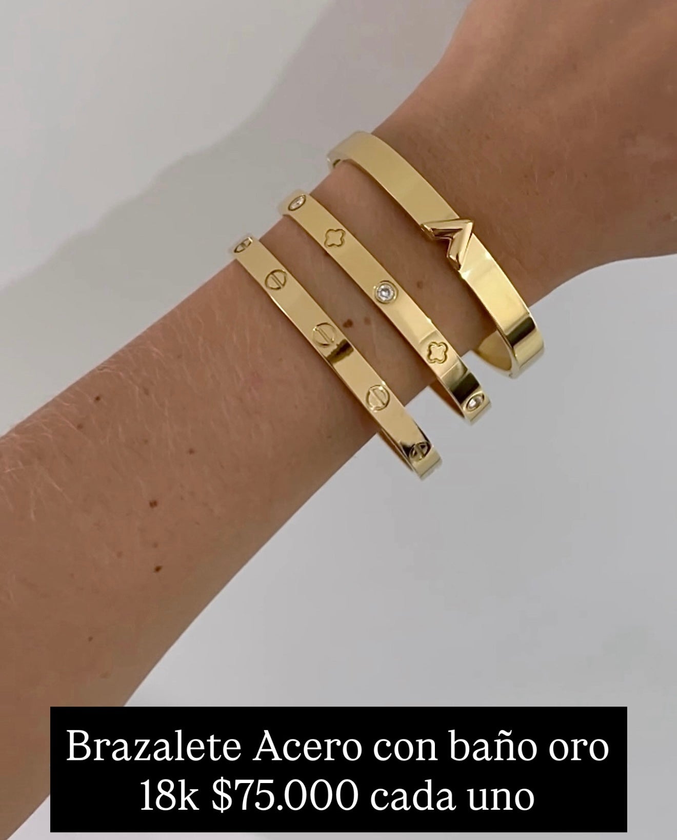 Brazalete acero con baño oro 18k