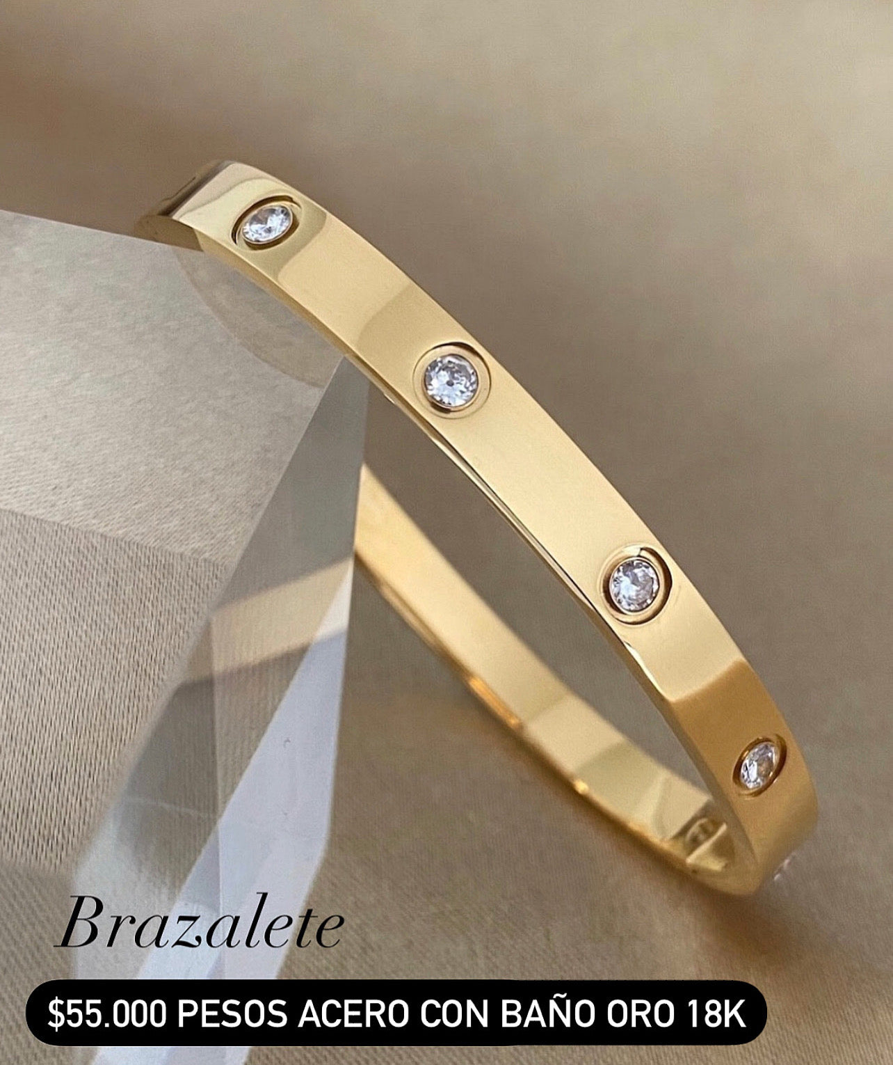 Brazalete acero con baño oro 18k
