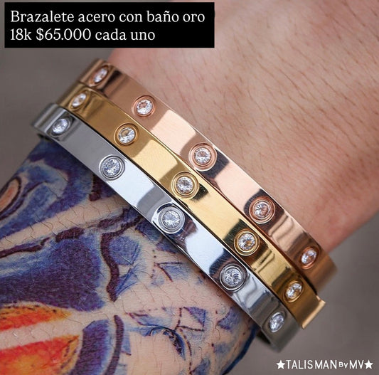 Brazalete grueso acero con baño oro 18k