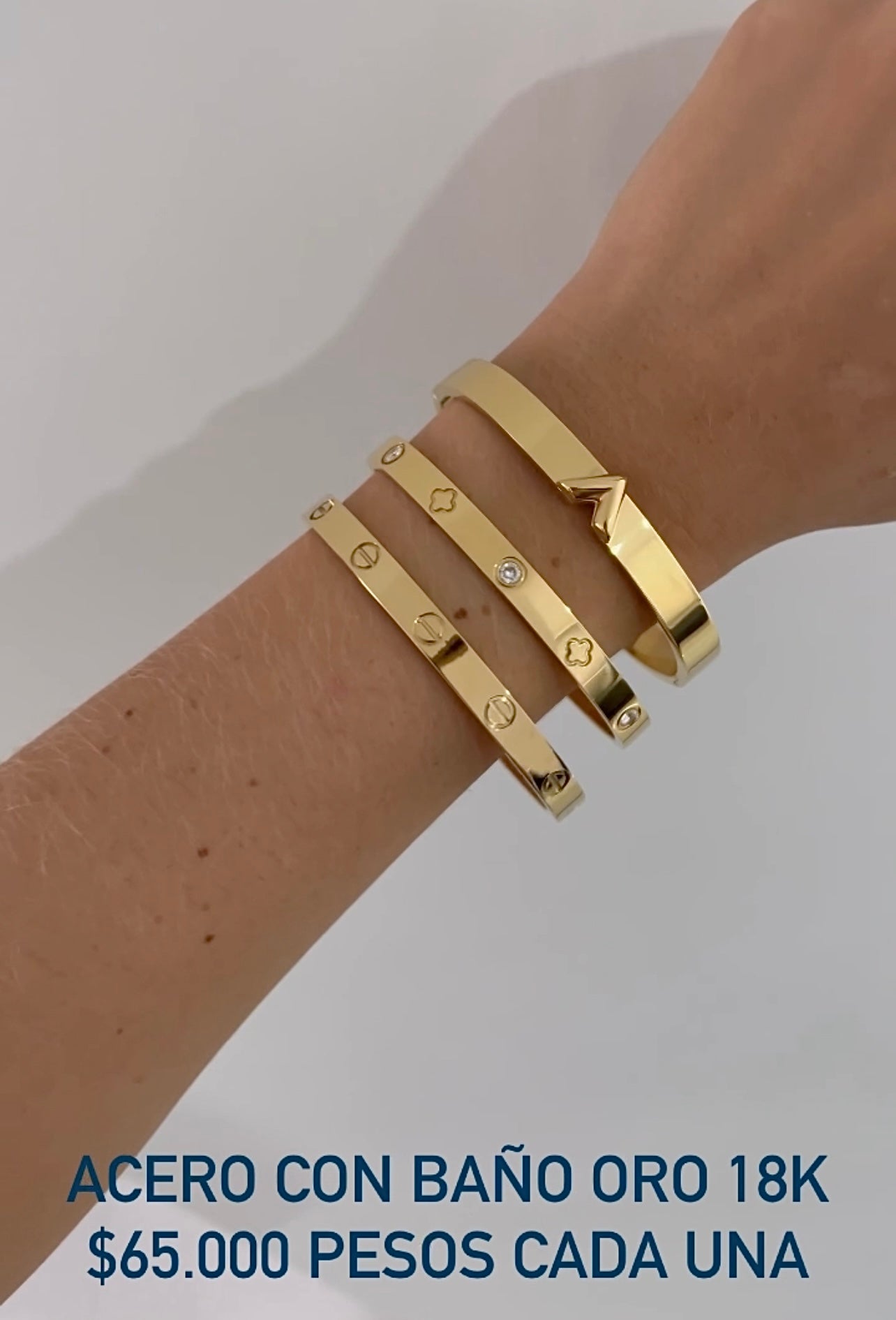 Brazalete acero con baño oro 18k