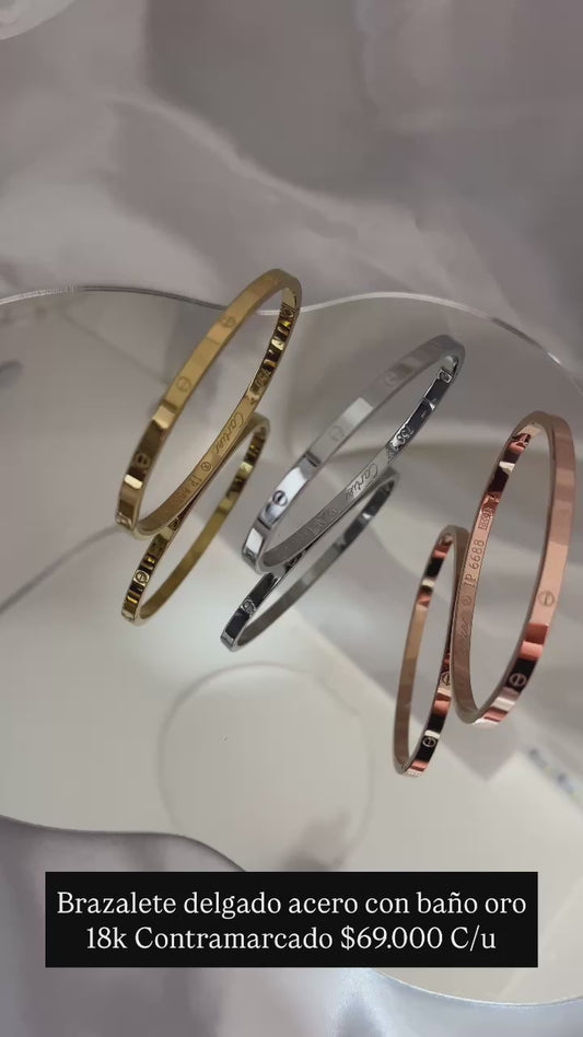Pulsera delgada acero con baño oro 18k (Contramarcada)