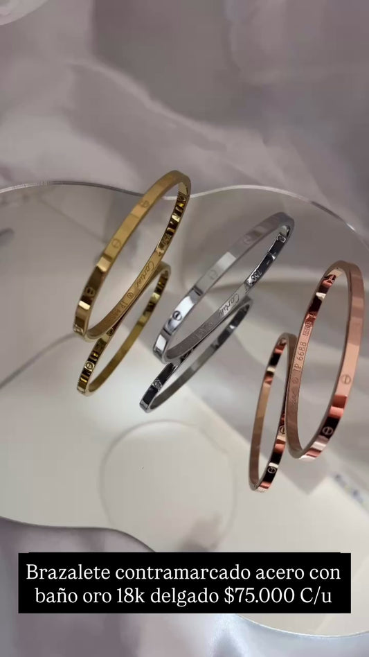 Pulsera delgada acero con baño oro 18k (Contramarcada)